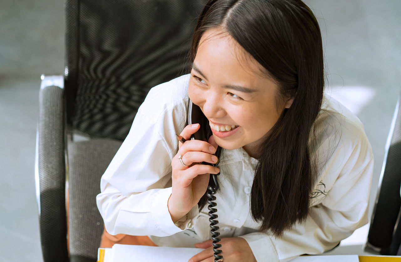 Person on phone smiling