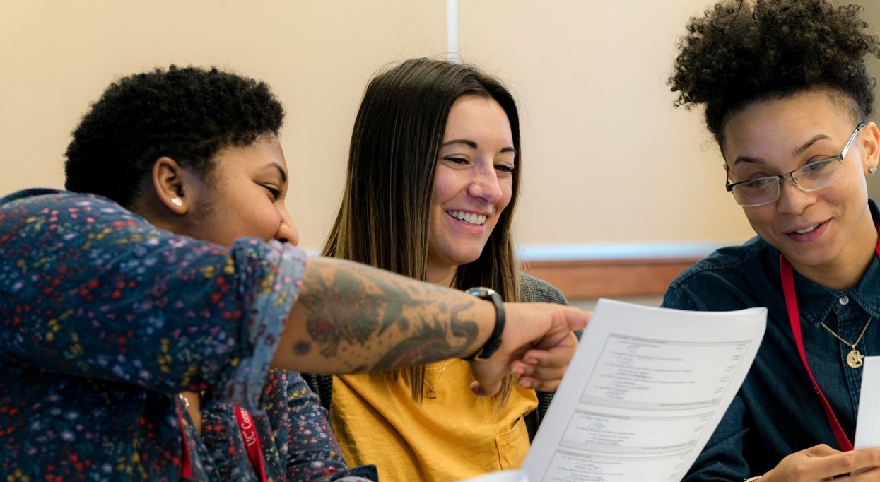 Trainees reviewing a worksheet