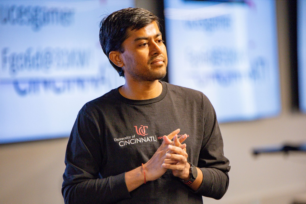 A University of Cincinnati student in the IT program presents in a classroom
