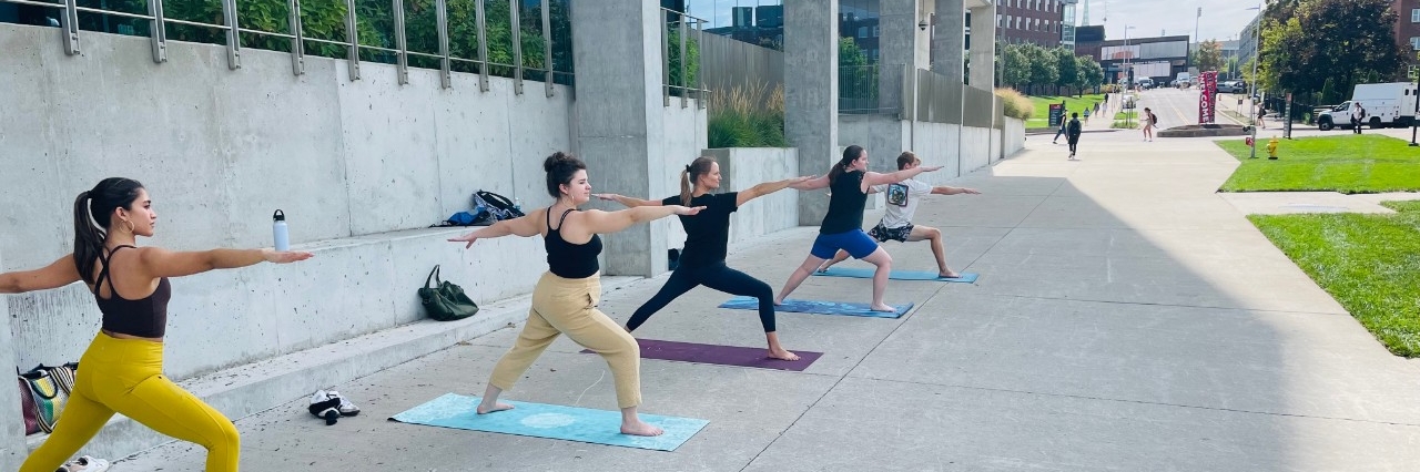 A group of students posing on a basketball court